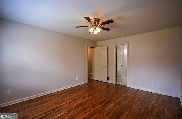 2048 Kelvin Dr, Lawrenceville, GA 30043 - unfurnished bedroom featuring dark wood finished floors and a ceiling fan