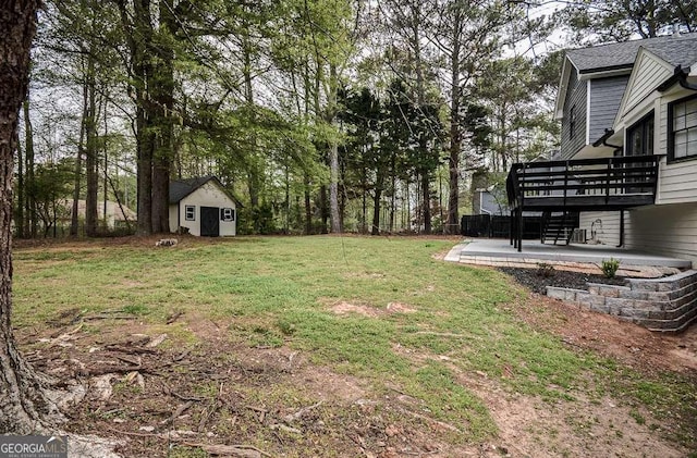 2048 Kelvin Dr, Lawrenceville, GA 30043 - view of grassy yard with a wooden deck, a shed, and a patio