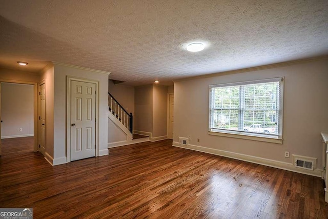 2048 Kelvin Dr, Lawrenceville, GA 30043 - spare room featuring stairs, wood finished floors, crown molding, and a textured ceiling