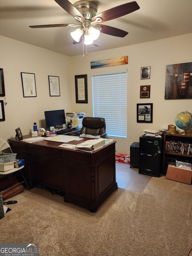 office with light carpet and a ceiling fan