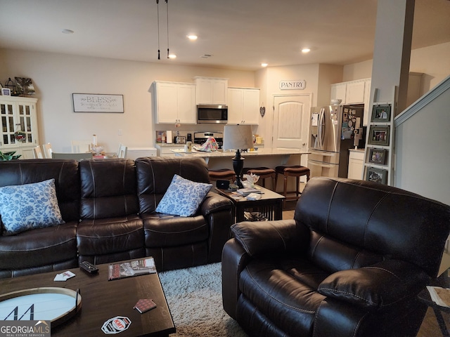 living room featuring recessed lighting