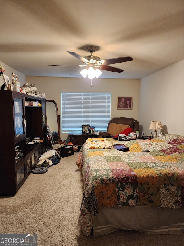 bedroom featuring ceiling fan and carpet floors