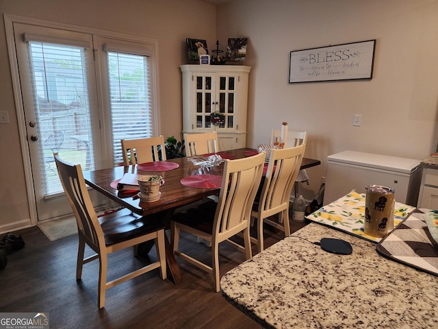 dining room with dark wood-type flooring