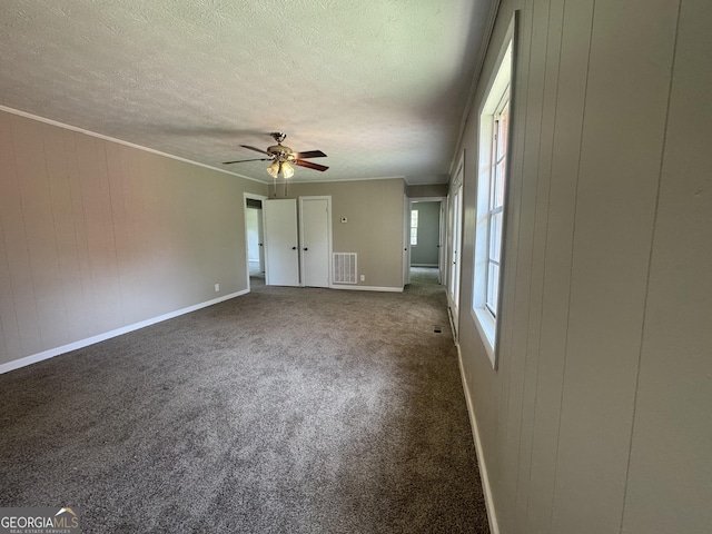 22 Spring Ave, Mcrae-Helena, GA 31055 - unfurnished living room with ceiling fan, a textured ceiling, and carpet flooring