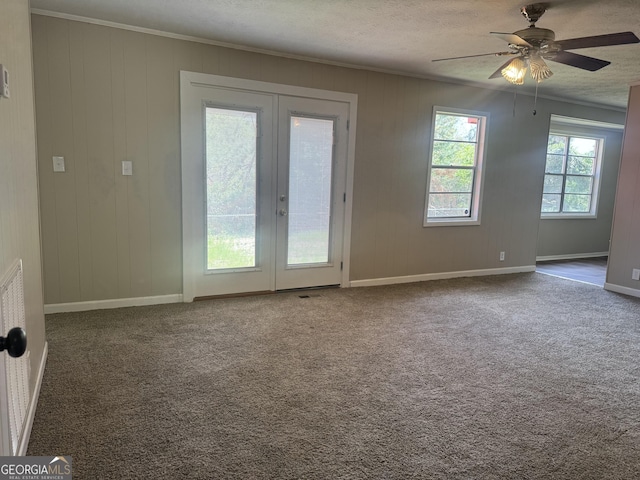 22 Spring Ave, Mcrae-Helena, GA 31055 - empty room featuring french doors, carpet, a ceiling fan, ornamental molding, and a textured ceiling