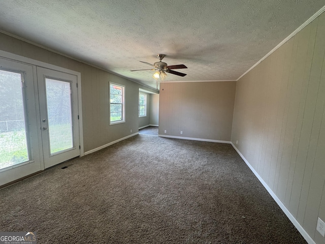 22 Spring Ave, Mcrae-Helena, GA 31055 - unfurnished room with french doors, a textured ceiling, carpet, a ceiling fan, and crown molding