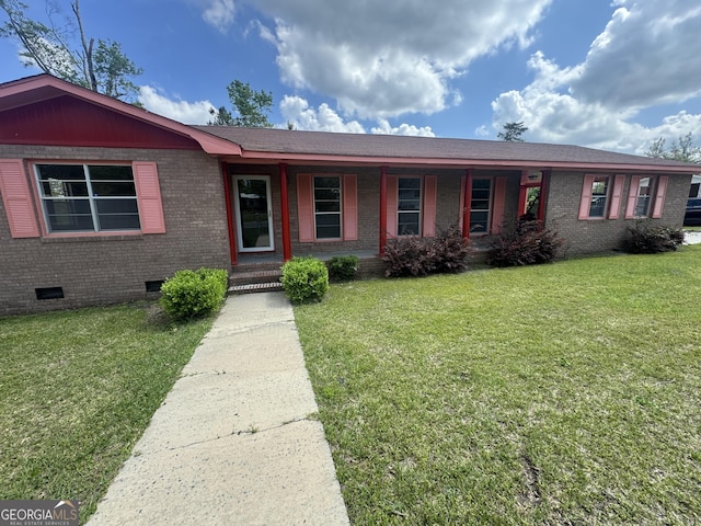 22 Spring Ave, Mcrae-Helena, GA 31055 - ranch-style house featuring crawl space, brick siding, a porch, and a front lawn