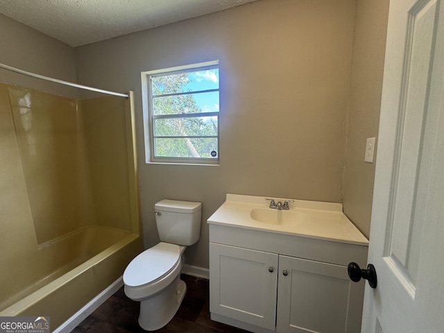 22 Spring Ave, Mcrae-Helena, GA 31055 - full bath with vanity,  shower combination, a textured ceiling, and wood finished floors