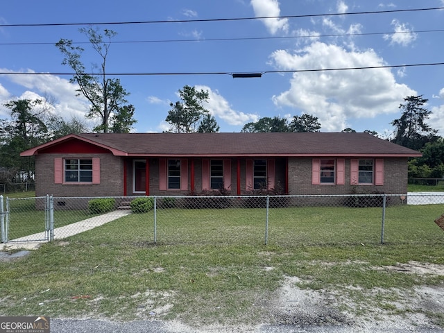 22 Spring Ave, Mcrae-Helena, GA 31055 - ranch-style house featuring brick siding and a fenced front yard