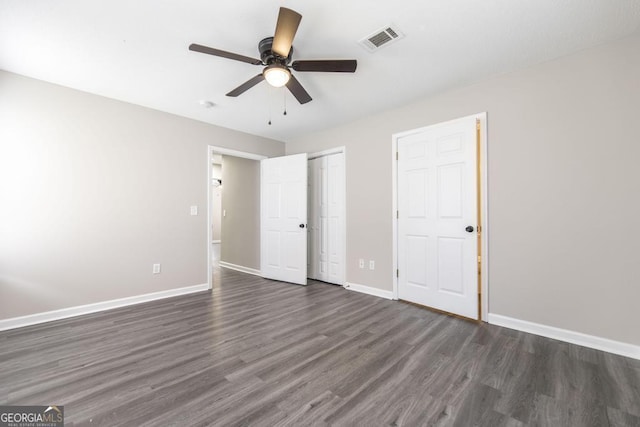 3 Joseph Rullo St, Hawkinsville, GA 31036 - unfurnished bedroom with dark wood-style flooring, baseboards, visible vents, a ceiling fan, and a closet