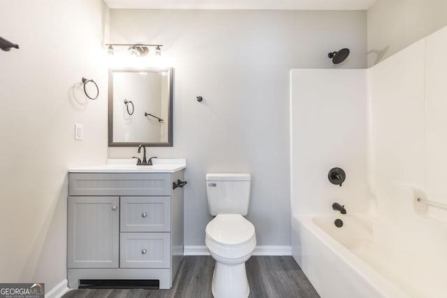 3 Joseph Rullo St, Hawkinsville, GA 31036 - full bathroom with vanity, toilet, baseboards,  shower combination, and wood finished floors
