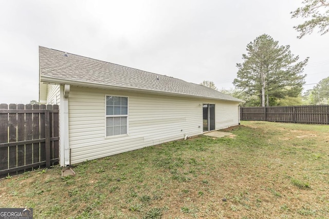 3 Joseph Rullo St, Hawkinsville, GA 31036 - back of property with roof with shingles, fence, and a yard