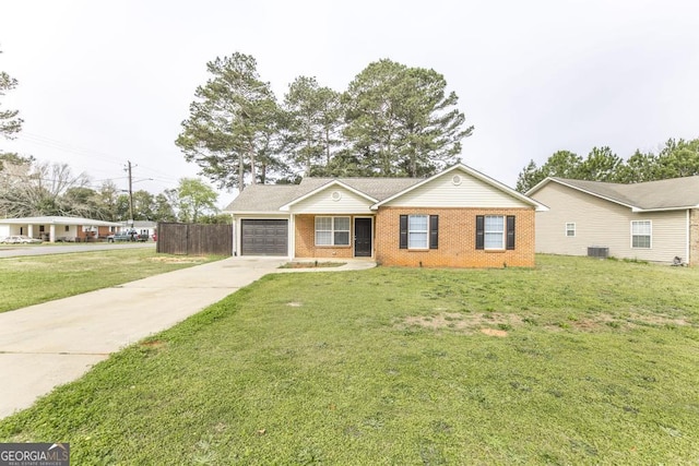 3 Joseph Rullo St, Hawkinsville, GA 31036 - single story home with central air condition unit, an attached garage, driveway, a front lawn, and brick siding