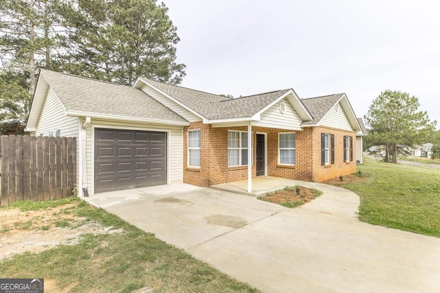 3 Joseph Rullo St, Hawkinsville, GA 31036 - ranch-style home with an attached garage, brick siding, fence, and concrete driveway