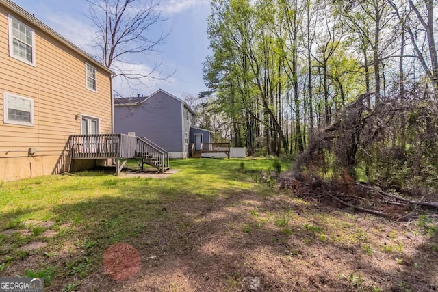 view of yard with a deck