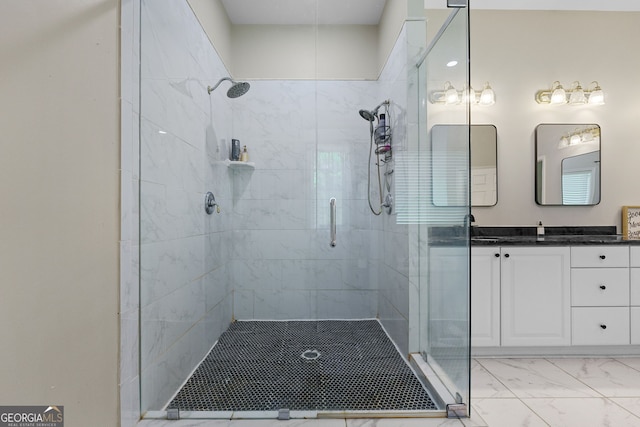 bathroom with a shower stall, marble finish floor, and vanity