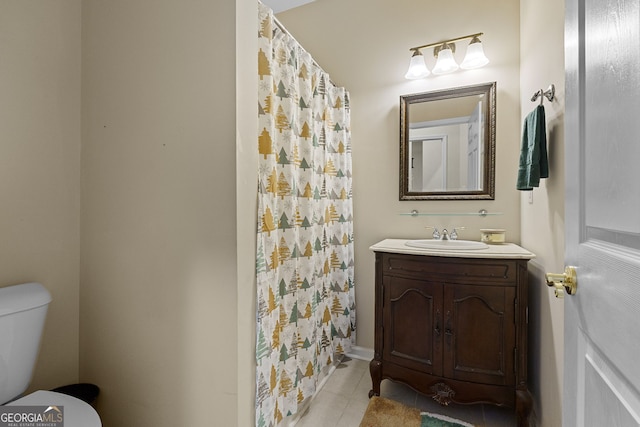 full bathroom featuring toilet, vanity, a shower with shower curtain, and tile patterned flooring