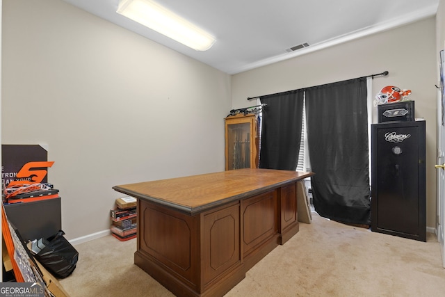 office space featuring light carpet, baseboards, and visible vents