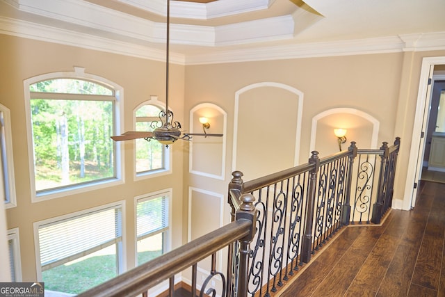 hallway with crown molding, an upstairs landing, plenty of natural light, and hardwood / wood-style floors