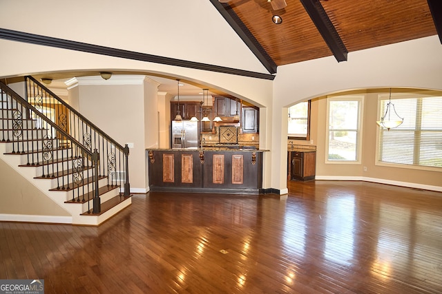 unfurnished living room featuring vaulted ceiling with beams, baseboards, wood ceiling, and dark wood-type flooring