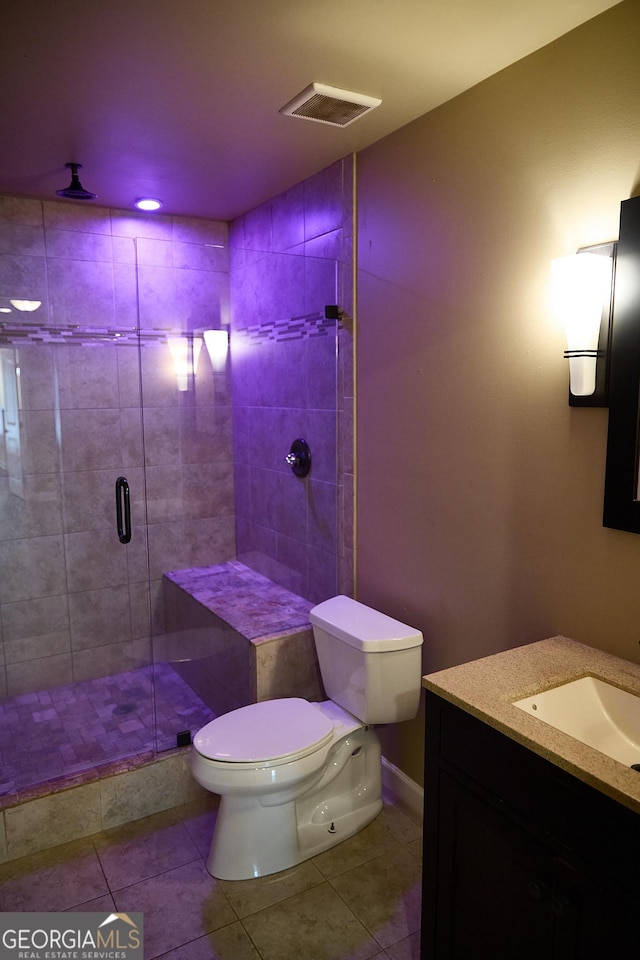 full bath featuring visible vents, tile patterned flooring, a stall shower, vanity, and toilet