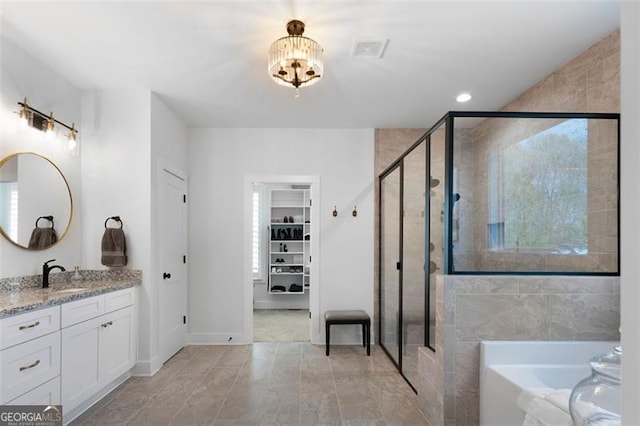 9 Grove Pointe Way, Cartersville, GA 30120 - bathroom with a stall shower, vanity, a bath, and a chandelier