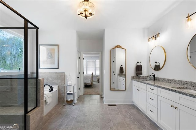 9 Grove Pointe Way, Cartersville, GA 30120 - ensuite bathroom featuring double vanity, a bath, a chandelier, baseboards, and a shower