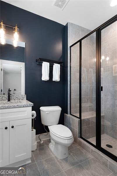 9 Grove Pointe Way, Cartersville, GA 30120 - bathroom featuring a stall shower, toilet, and vanity