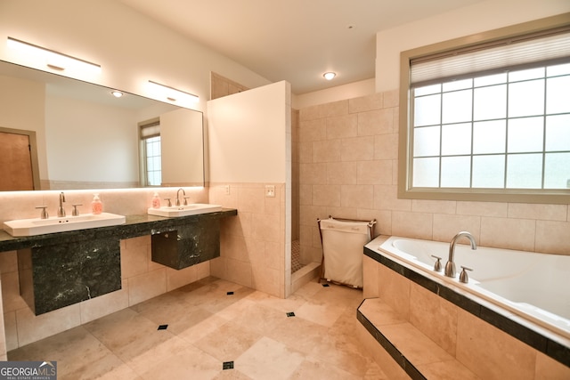 412 Trilium Trl, Pendergrass, GA 30567 - full bathroom with tile walls, a garden tub, tile patterned floors, and dual sinks