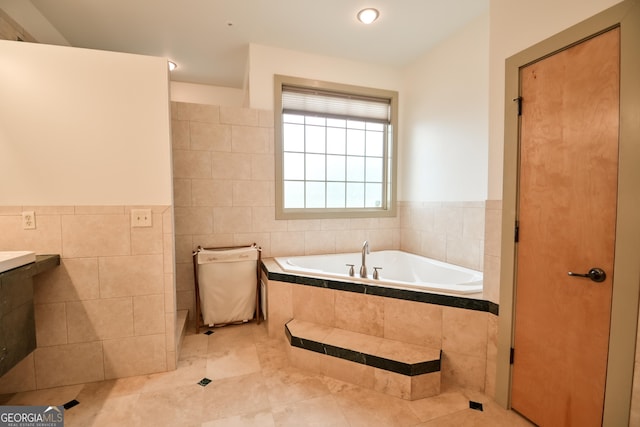 412 Trilium Trl, Pendergrass, GA 30567 - full bathroom with tile walls, a garden tub, vanity, tile patterned flooring, and a wainscoted wall