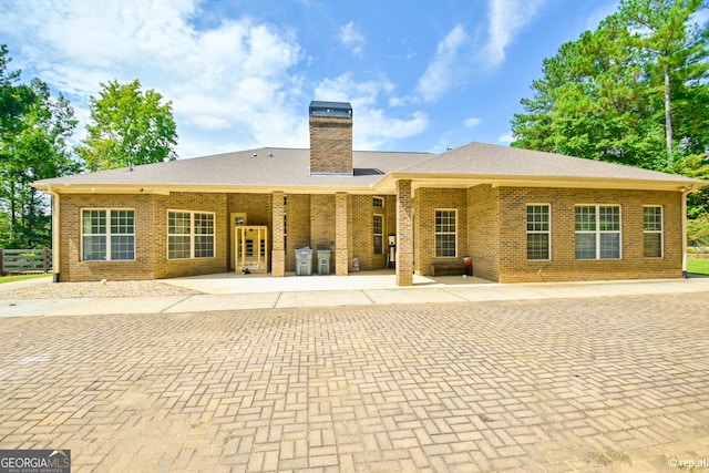 412 Trilium Trl, Pendergrass, GA 30567 - back of property with a chimney and brick siding