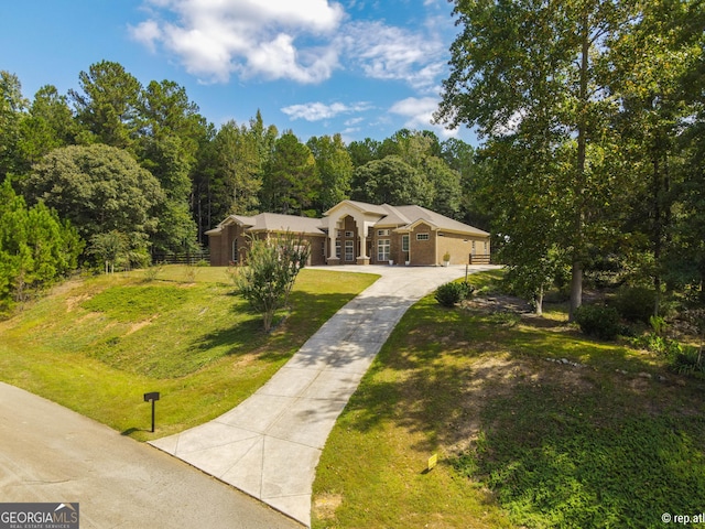 412 Trilium Trl, Pendergrass, GA 30567 - view of front of home with driveway and a forest view