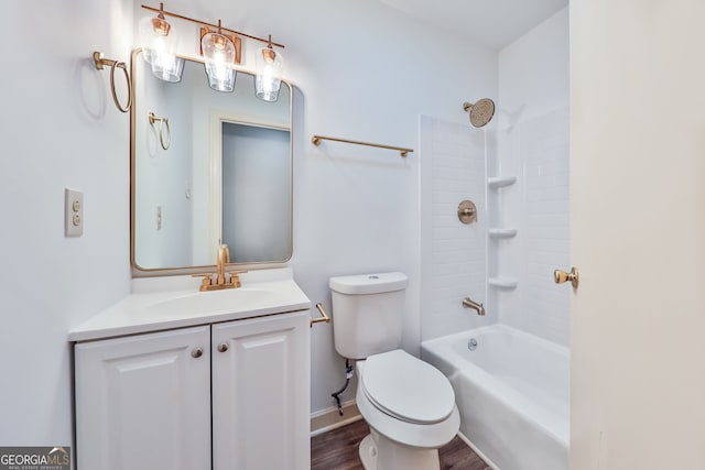 bathroom with wood finished floors, vanity, baseboards, toilet, and shower / bathtub combination