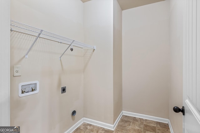 washroom featuring hookup for an electric dryer, laundry area, baseboards, and washer hookup