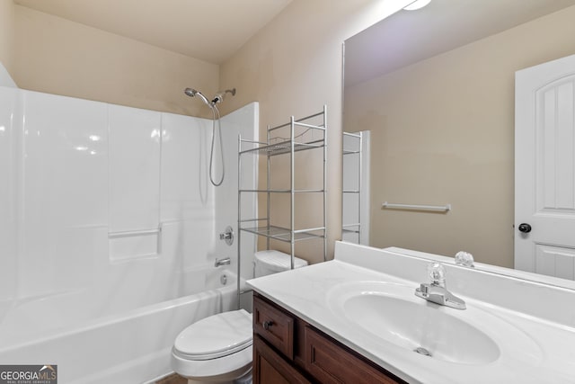 full bathroom with  shower combination, vanity, and toilet