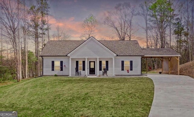 121 Tricias Way, Temple, GA 30179 - ranch-style home with a front yard, concrete driveway, a porch, and a carport