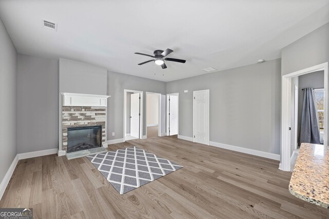 121 Tricias Way, Temple, GA 30179 - kitchen with a sink, light stone countertops, tasteful backsplash, appliances with stainless steel finishes, and light wood-style flooring