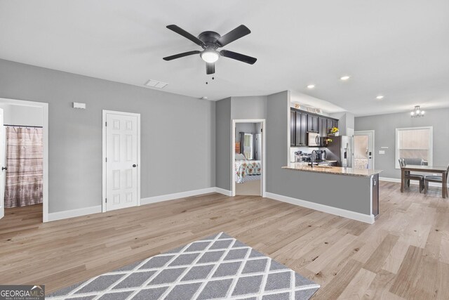 121 Tricias Way, Temple, GA 30179 - living room featuring wood finished floors, a glass covered fireplace, baseboards, visible vents, and ceiling fan