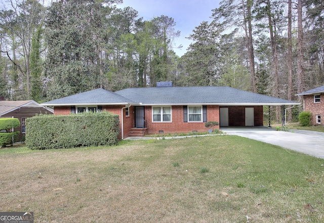 ranch-style home featuring a front yard, concrete driveway, an attached carport, brick siding, and crawl space