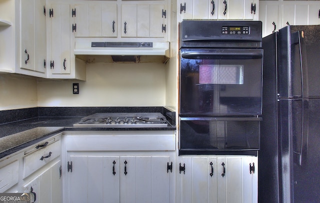 kitchen featuring under cabinet range hood, white cabinetry, black appliances, and a warming drawer