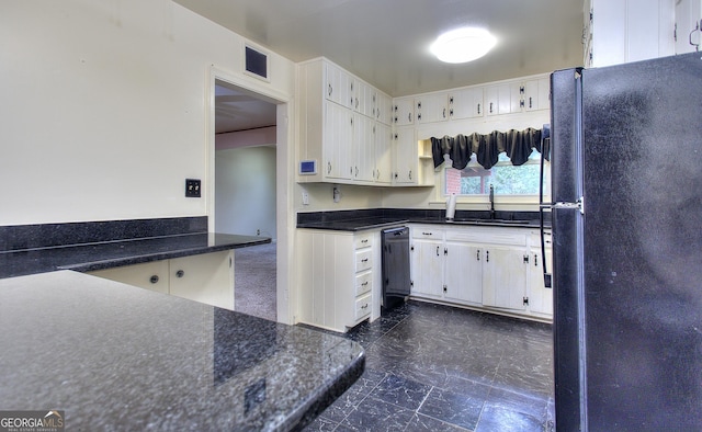 kitchen featuring visible vents, marble finish floor, dark countertops, a sink, and black appliances