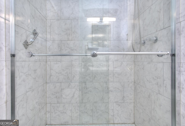 bathroom with a shower stall