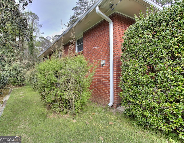view of home's exterior featuring brick siding