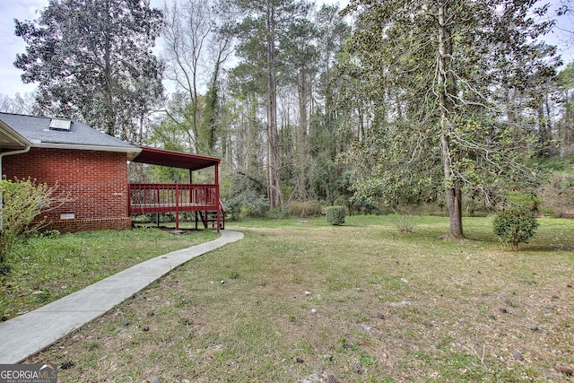 view of yard featuring a deck