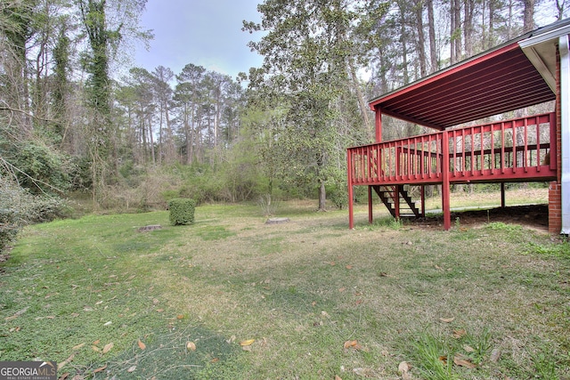 view of yard with a wooden deck