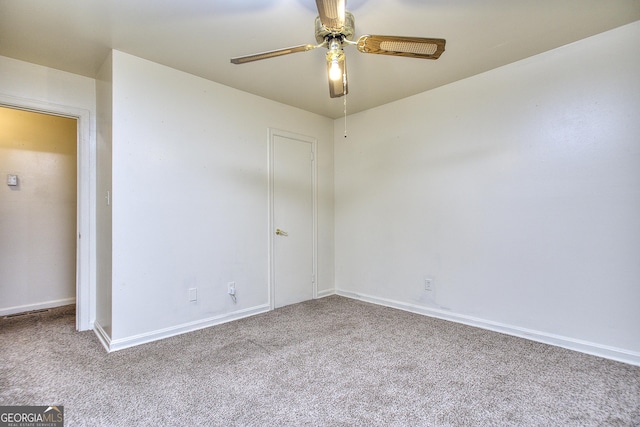 unfurnished bedroom with baseboards, ceiling fan, and carpet