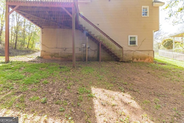 back of house with fence and stairway