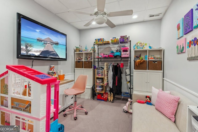 playroom featuring a drop ceiling, a ceiling fan, carpet, and visible vents