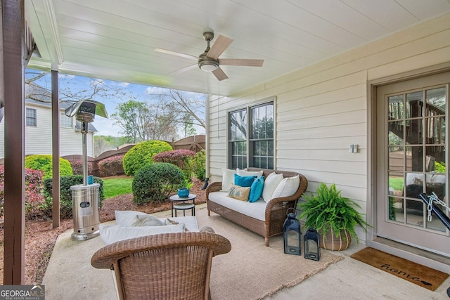 view of patio featuring a ceiling fan and outdoor lounge area