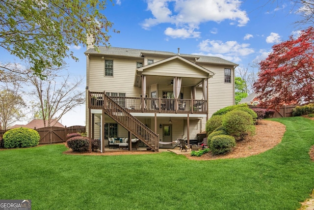 back of house with a gate, fence, a chimney, a ceiling fan, and a patio area